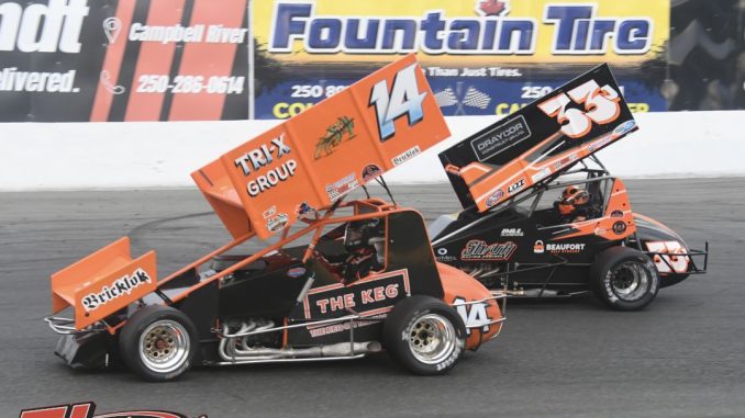 Brandon Carlson (#14) and Jeff Montgomery (#33J) racing for position Friday at Saratoga Speedway. (David Sink Photo)