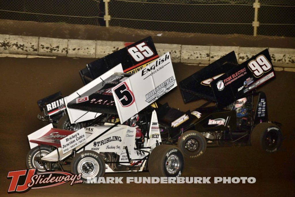 Mario Clouser (#5H) racing with Jordan Goldesberry (#65) and Joey Moughan (#99) Friday at Jacksonville Speedway. (Mark Funderburk Photo)