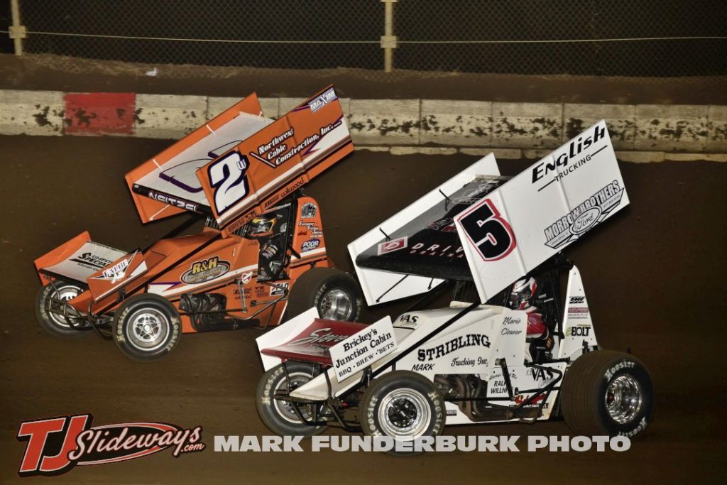 Mario Clouser (#5H) racing with Scotty Neitzel (#2W) Friday at Jacksonville Speedway. (Mark Funderburk Photo)