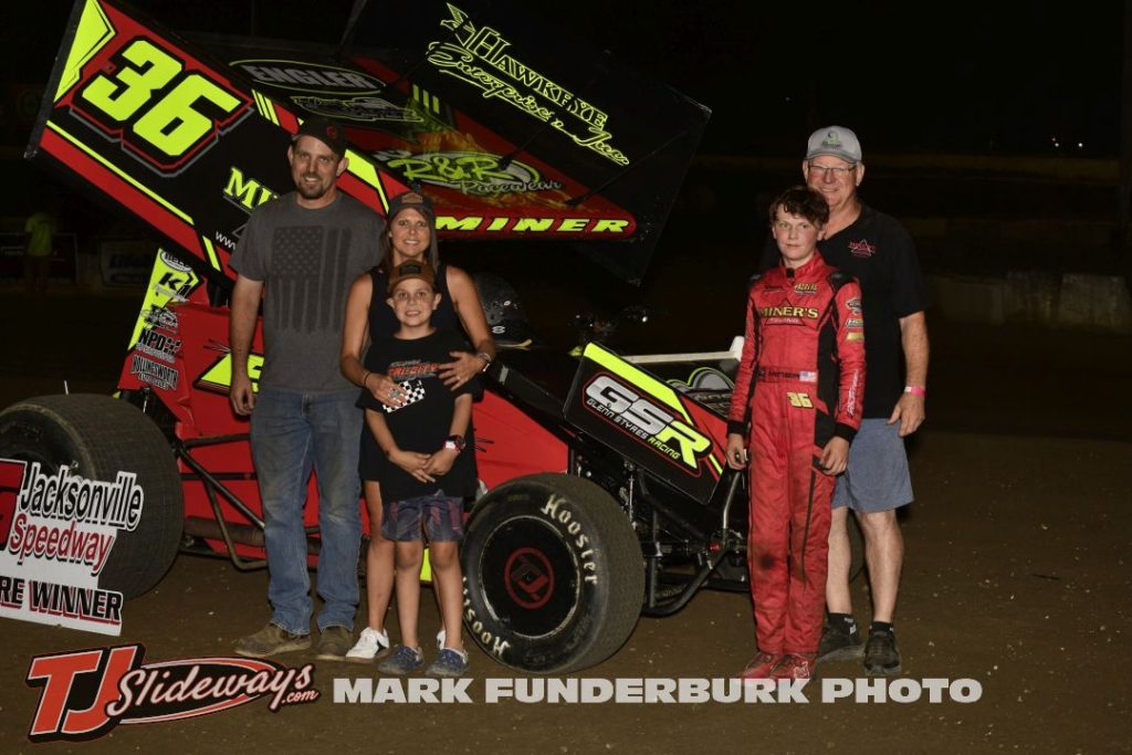 Landon Miner with his family after winning the 305 sprint car feature Friday at Jacksonville Speedway. (Mark Funderburk Photo)