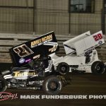 James McFadden (#21) racing with Chase Park (#28) Wednesday night at Knoxville Raceway. (Mark Funderburk Photo)