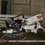 James McFadden (#21) racing with Jace Park (#28) for the lead Wednesday night at Knoxville Raceway. (Mark Funderburk Photo)