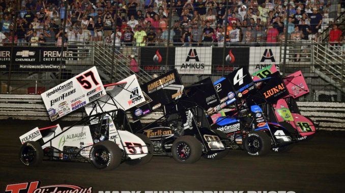 The parade lap for the 65th Knoxville Nationals finale with Kyle Larson (#57), James McFadden (#21T), Kasey Kahne (#4), and Sheldon Haudenschild (#4). (Mark Funderburk Photo)