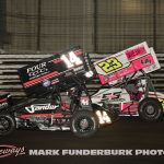 Corey Day (#14) racing with Garet Williamson (#23) Saturday during the 65th Knoxville Nationals. (Mark Funderburk Photo)