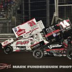 Brian Brown (#21) racing with Corey Day (#14) for position Saturday during the finale of the 65th Knoxville Nationals. (Mark Funderburk Photo)