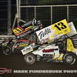 Tanner Holmes (#13) racing with Corey Day (#14) for position Saturday during the 65th Knoxville Nationals. (Mark Funderburk Photo)