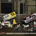 Tanner Holmes (#13) racing with Brent Marks (#19) Saturday during the finale of the 65th Knoxville Nationals. (Mark Funderburk Photo)