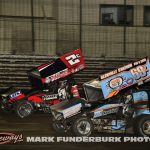 Cole Macedo (#2C) racing with Daryn Pittman (#69K) for position Saturday during the finale of the 65th Knoxville Nationals. (Mark Funderburk Photo)