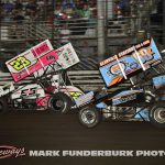 Garet Williamson (#23) racing with Daryn Pittman (#69K for position Saturday during the finale of the 65th Knoxville Nationals. (Mark Funderburk Photo)