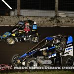 Mario Clouser (#75) racing around the outside of Chet Gehrke (#21) for the lead Friday at Lincoln Speedway. (Mark Funderburk Photo)