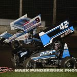 Paul Nienhiser (#9X) going around the outside of Preston Perlmutter (#42) Friday at Lincoln Speedway. (Mark Funderburk Photo)