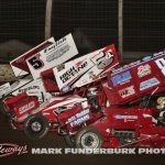 Mitchell Davis (#33), Zach Daum (#5D), and Mario Clouser (#5H) racing three wide during MOWA action Friday at Lincoln Speedway. (Mark Funderburk Photo)