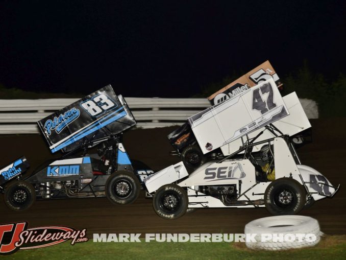 Kurt Mueller (#83), Tony Shilling (#47), and Alex Vande Voort (#5A) racing for position Monday night at Marshalltown Speedway. (Mark Funderburk Photo)