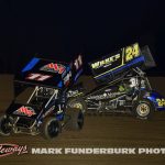 Colton Fisher (#11) racing with Eric Wilke (#24) Monday at Marshalltown Speedway. (Mark Funderburk Photo)