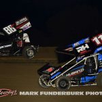 Rodney Huband (#11R) and Ryder Laplante (#88R) racing for position Monday at Marshalltown Speedway. (Mark Funderburk Photo)