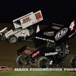 Riley Goodno (#22) racing with Cameron Martin (#4) for position Monday night at Marshalltown Speedway. (Mark Funderburk Photo)