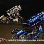Jackson Gray (#7G) racing with Tasker Phillips (#1TAZ) Monday at Marshalltown Speedway. (Mark Funderburk Photo)