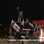 Garrett Benson celebrating his feature victory Monday night at Marshalltown Speedway. (Mark Funderburk Photo)