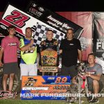 Garrett Benson with his family and crew in victory lane Monday night at Marshalltown Speedway. (Mark Funderburk Photo)