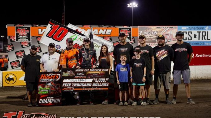 Ryan Timms with his crew after winning the feature event on the final lap Sunday night at Huset's Speedway. (Tyler Porath Photo)