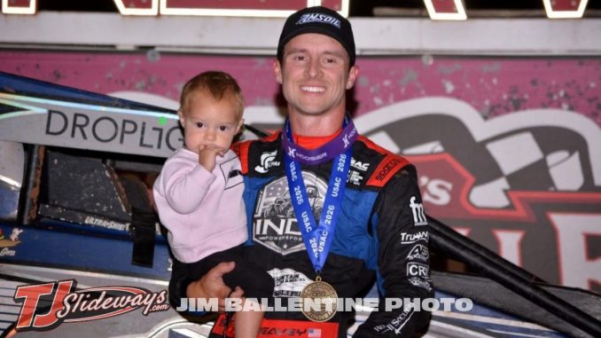 Logan Seavey celebrates with his daughter, Lane, after winning Friday night's Commonwealth Clash at Sarver, Pennsylvania's Lernerville Speedway. (Jim Balentine Photo)
