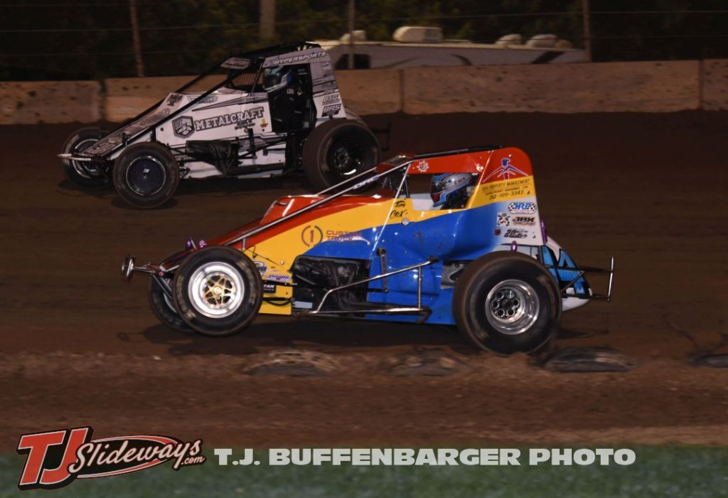 Tim Cox (#14) inside of Allen Hafford (#38) Saturday at the Plymouth Dirt Track. (T.J. Buffenbarger Photo)