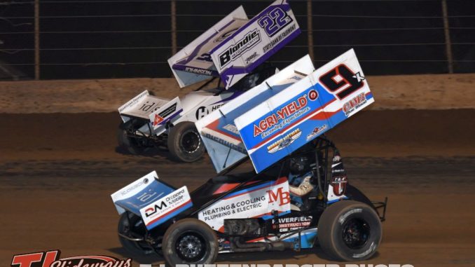 Paul Nienhiser (#9) racing with Caleb Johnson (#22) Saturday night at the Plymouth Dirt Track. (T.J. Buffenbarger Photo)