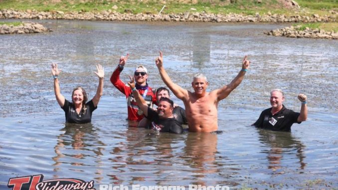 Winner C.J. Leary & the Team AZ / Petty-Rossi / Curb-Agajanian Racing crew celebrate Saturday's Ted Horn 100 USAC Silver Crown victory by taking a dive into the infield pond at the Du Quoin State Fairgrounds in southern Illinois. (Rich Forman Photo)