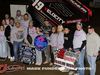 Joel Myers Jr. with the family of Ron Milton after winning the feature event on Friday at Jacksonville Speedway. (Mark Funderburk Photo)
