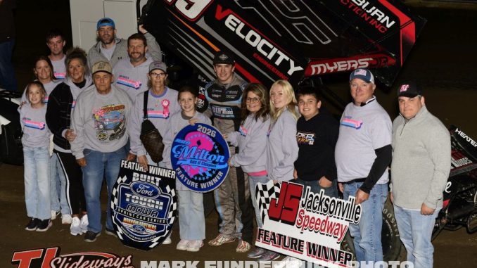 Joel Myers Jr. with the family of Ron Milton after winning the feature event on Friday at Jacksonville Speedway. (Mark Funderburk Photo)
